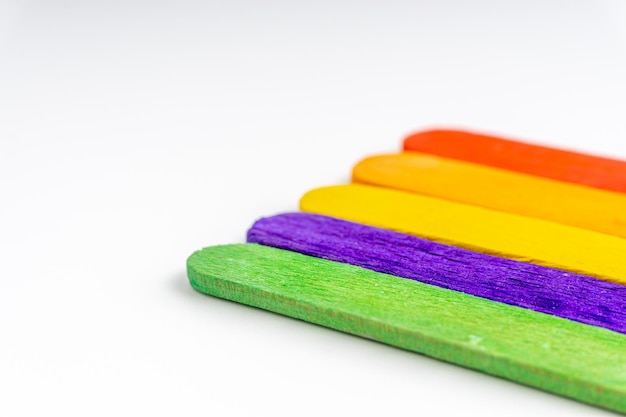 Close-up of colorful ice cream sticks on white background