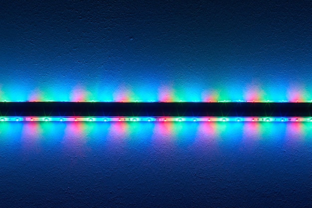 Photo close-up of colorful illuminated led on wall