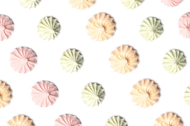 Close up of colorful meringues isolated on white background