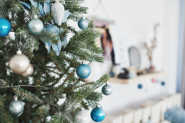 Close up of colorful ornaments on Christmas tree