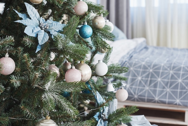 Close up of colorful ornaments on Christmas tree