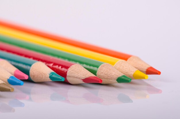 Close-up of colorful pencils on white background