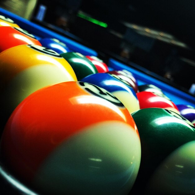 Photo close-up of colorful pool balls on table