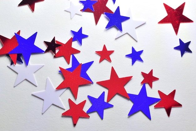 Photo close-up of colorful star shaped decorations on wall