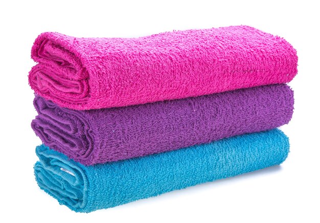 Close-up of colorful towels over white background