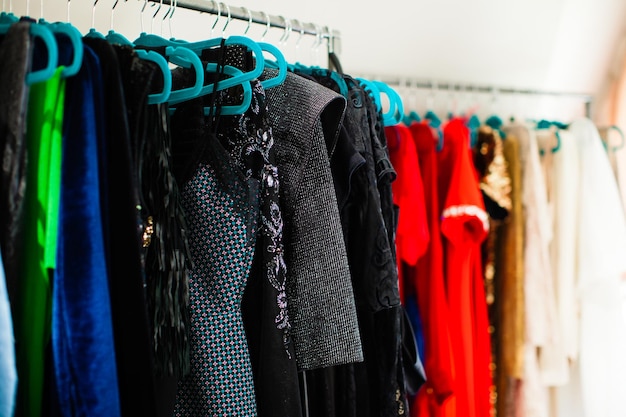 Close-up of colorful women's clothes hanging on hangers