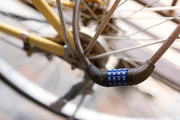 Close up of combination bike lock in front of bicycle