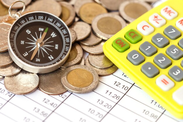 Close up Compass on coin stack