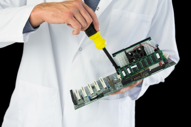 Close up of computer engineer repairing hardware at night