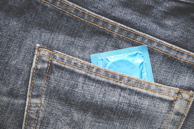 Close-up of condom packet in pocket