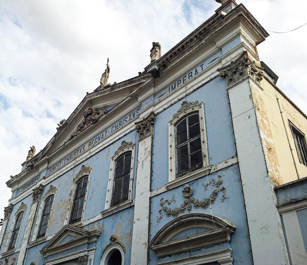 close up of a construction of an old blue church