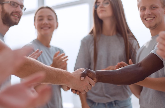 Close up contact group leaders shake hands