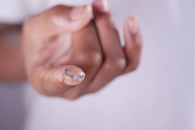 Close up of contact lens on a finger