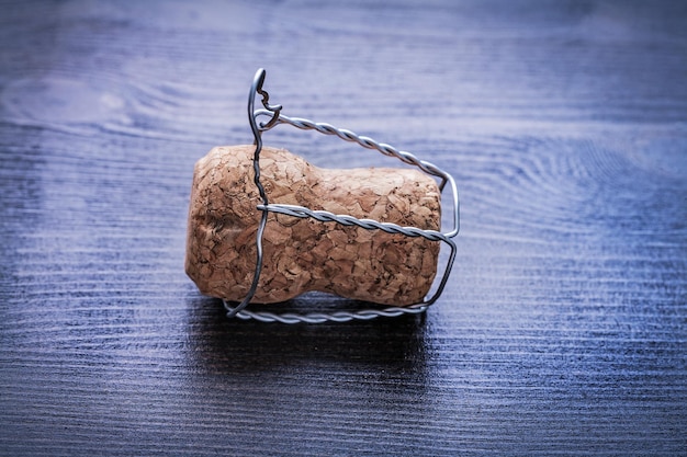 Close up corck of champagne and wire on board