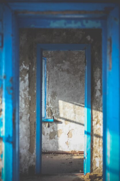 Close up corridor inside abandoned building illuminated by sunlight concept photo