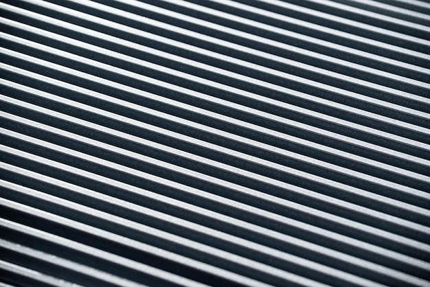 Close-up of a corrugated metal surface of an unidentified factory equipment