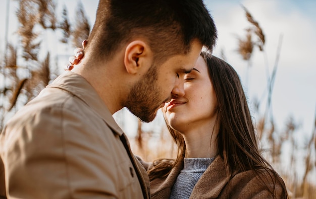 Close-up couple almost kissing