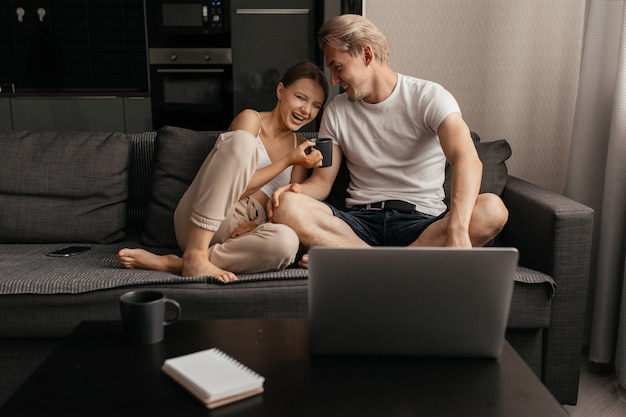 Close up on couple enjoying a drink together indoors