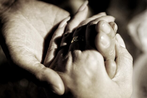 Close-up of couple hands