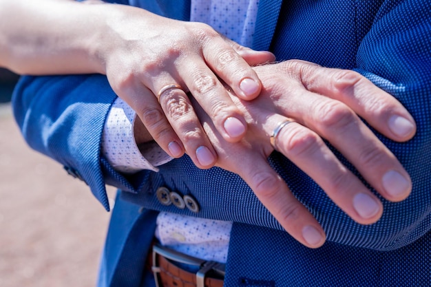 Close up of couple hold hands moment together demonstrate\
support and understandingsymbol sign sincere feelings compassion\
loved one say sorry reliable person true friendship concept