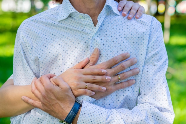 Close up of couple hold hands talking sharing secrets showing\
love and care husband and wife have tender close moment together\
demonstrate support and understandingworld peace concept