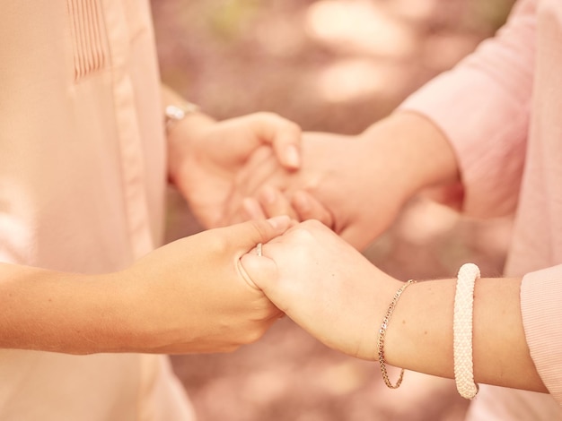 Close-up of couple holding hands