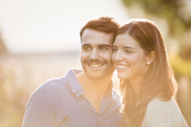 Close-up of couple looking away 