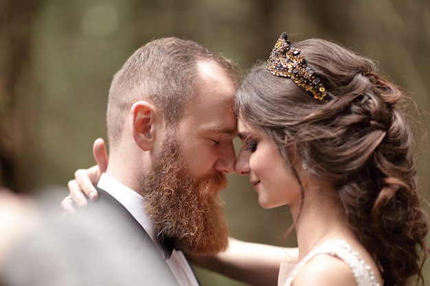 Close up.couple in love on the background of the forest.