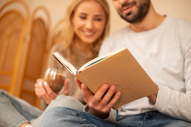close-up couple reading together