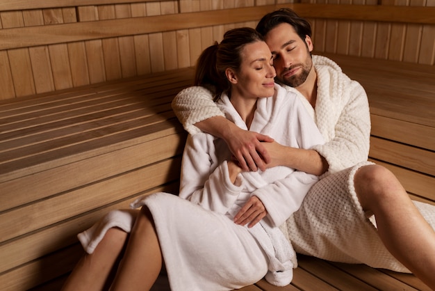 Photo close up on couple relaxing in the sauna