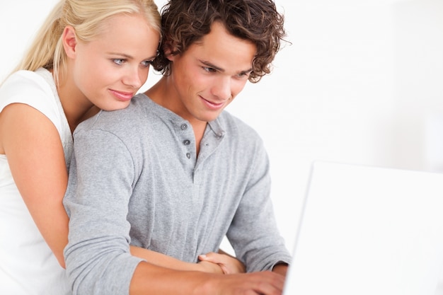 Close up of a couple using a laptop