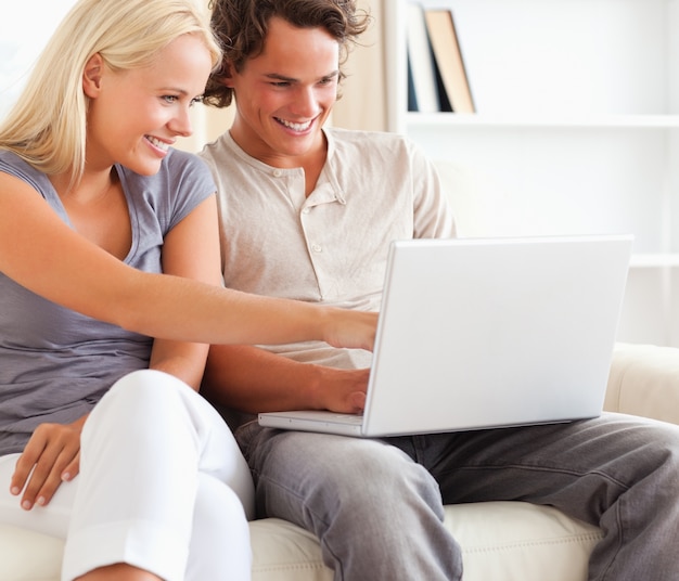 Close up of a couple using a laptop