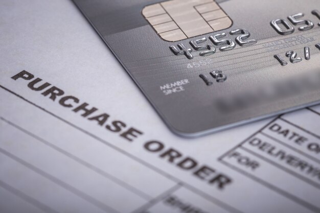 Close up credit card on purchase order in the office. For financial or business use