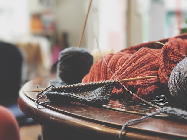 close-up of crochets on wooden table