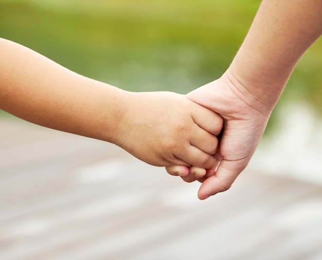 Close-up cropped couple holding hands