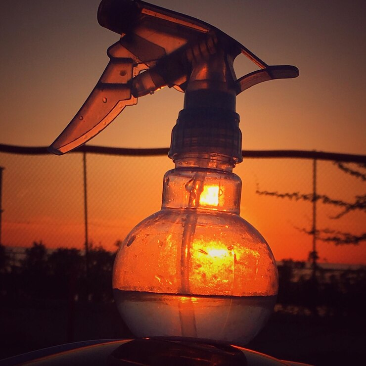 Photo close-up of cross against sky during sunset