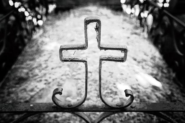close-up of cross on fence