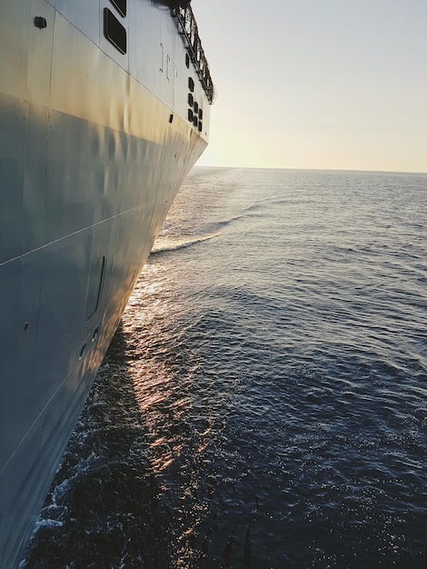 close-up of cruise ship on sea against clear sky