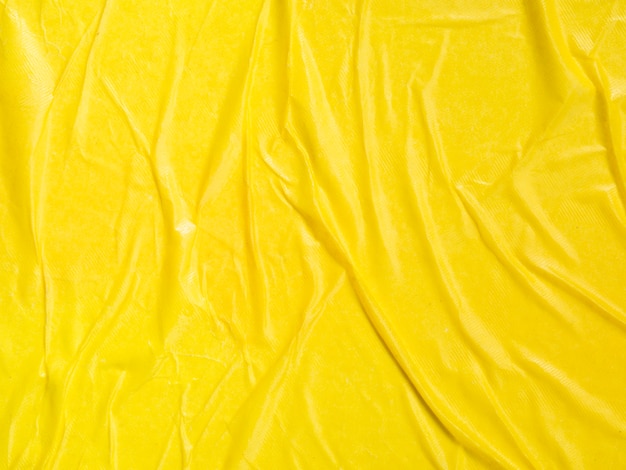 Close-up crumpled yellow paper background