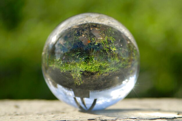 Close-up of crystal ball on glass