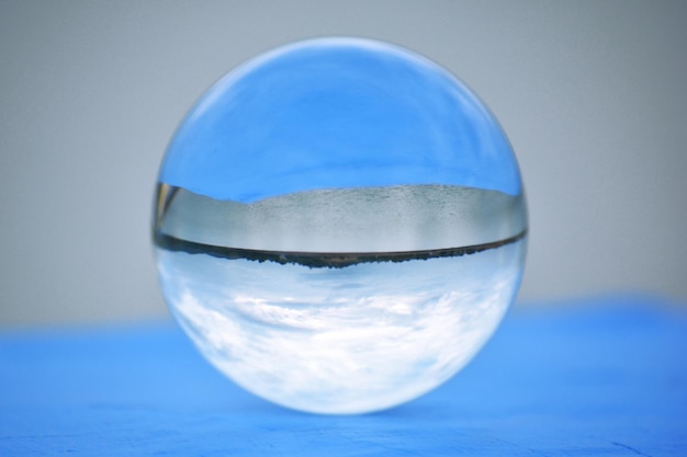 Photo close-up of crystal ball on retaining wall