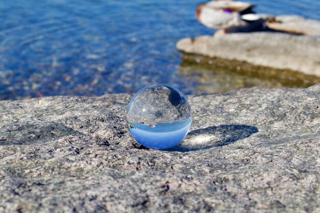 Close-up of crystal ball on rock