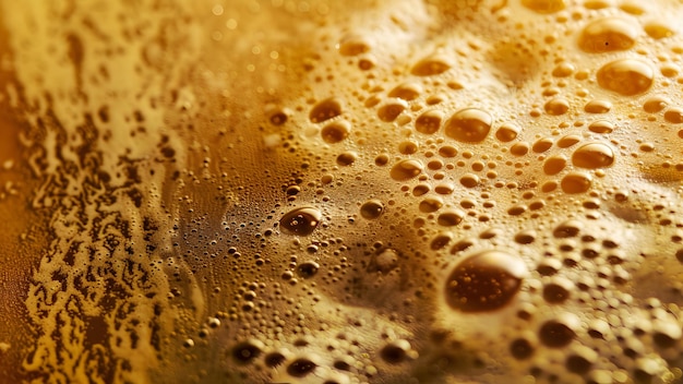 a close up of a cup of beer with bubbles and bubbles