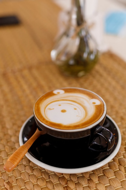 Close-up cup of hot caramel macchiato