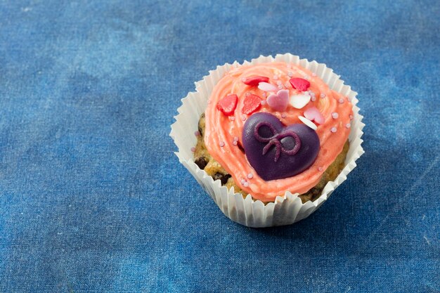 Photo close-up of cupcake against white background