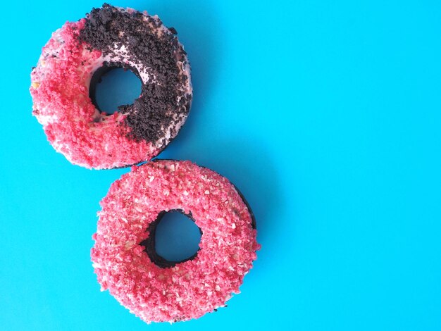 Close-up of cupcakes against blue background