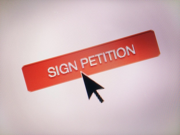 Photo close-up of cursor on sign petition icon