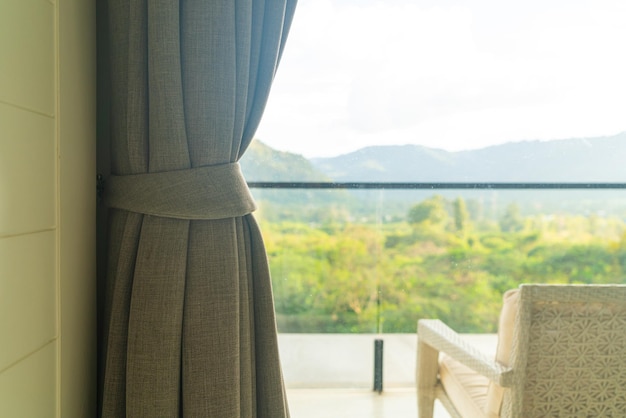 close up curtain with window and sunlight