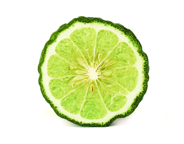 Close up a cut half of Bergamot fruit and leaf on white background 