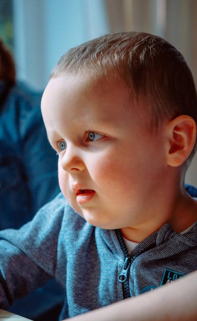 Close-up of cute baby boy at cafe